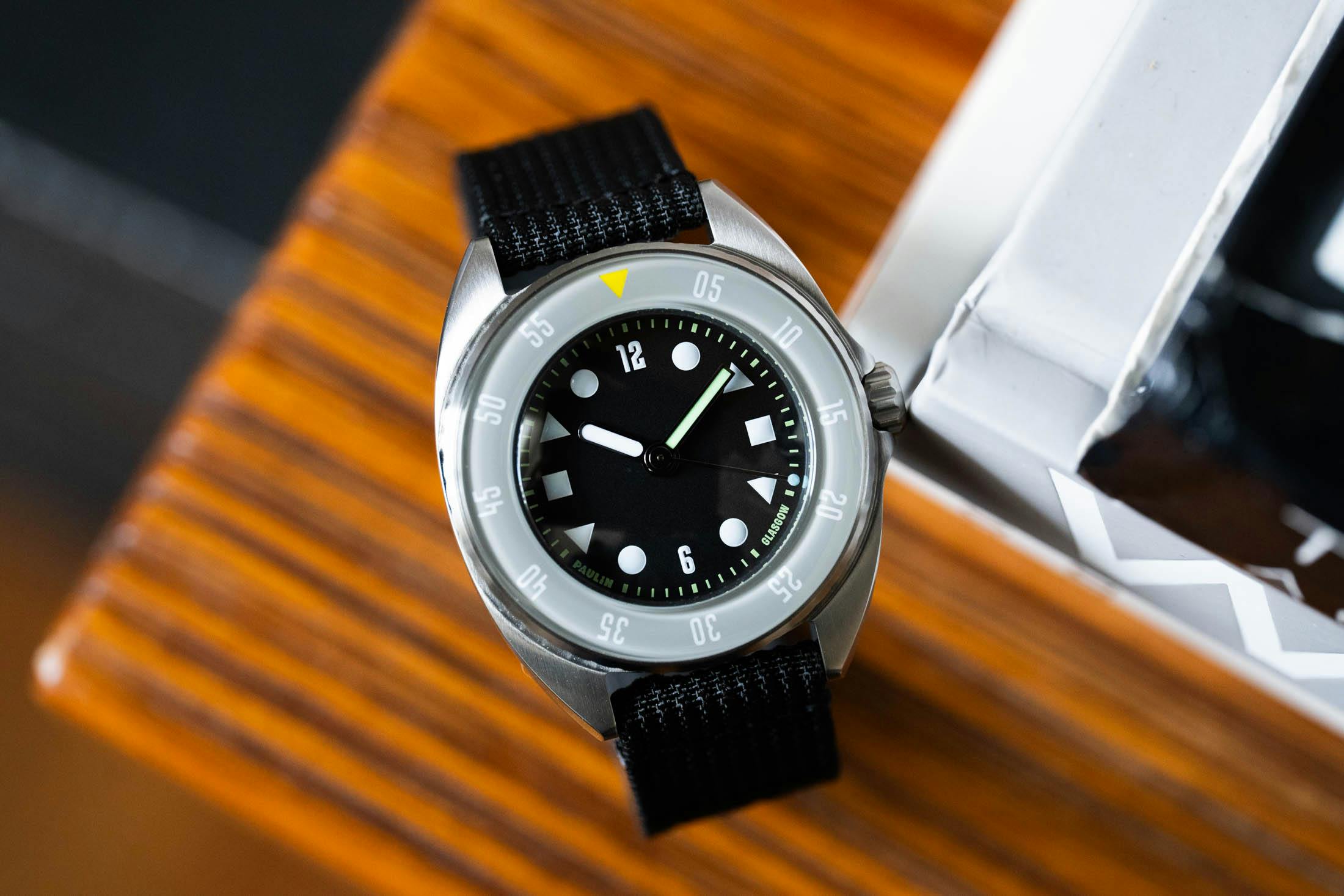 Paulin Mara on wooden desk