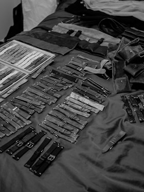 Our very first order of HODINKEE Straps arrive, I sort them on my bed.