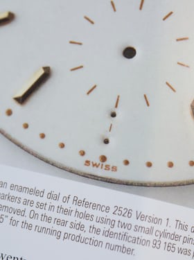 A first-series dial missing an hour marker.