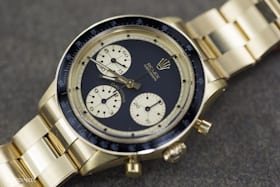 Lot 271: A Rolex "John Player Special" Newman; sold for CHF 305,000.