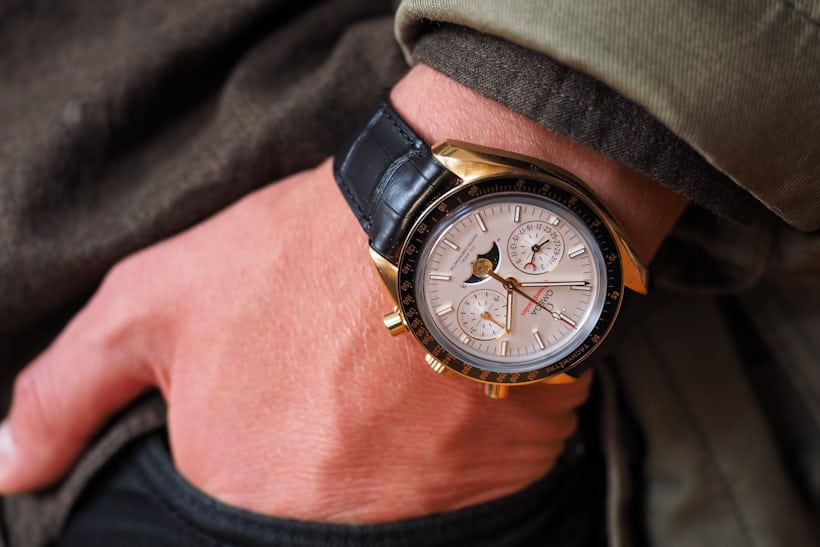 Omega Speedmaster Moonphase Master Chronometer Chronograph sedna gold wrist shot