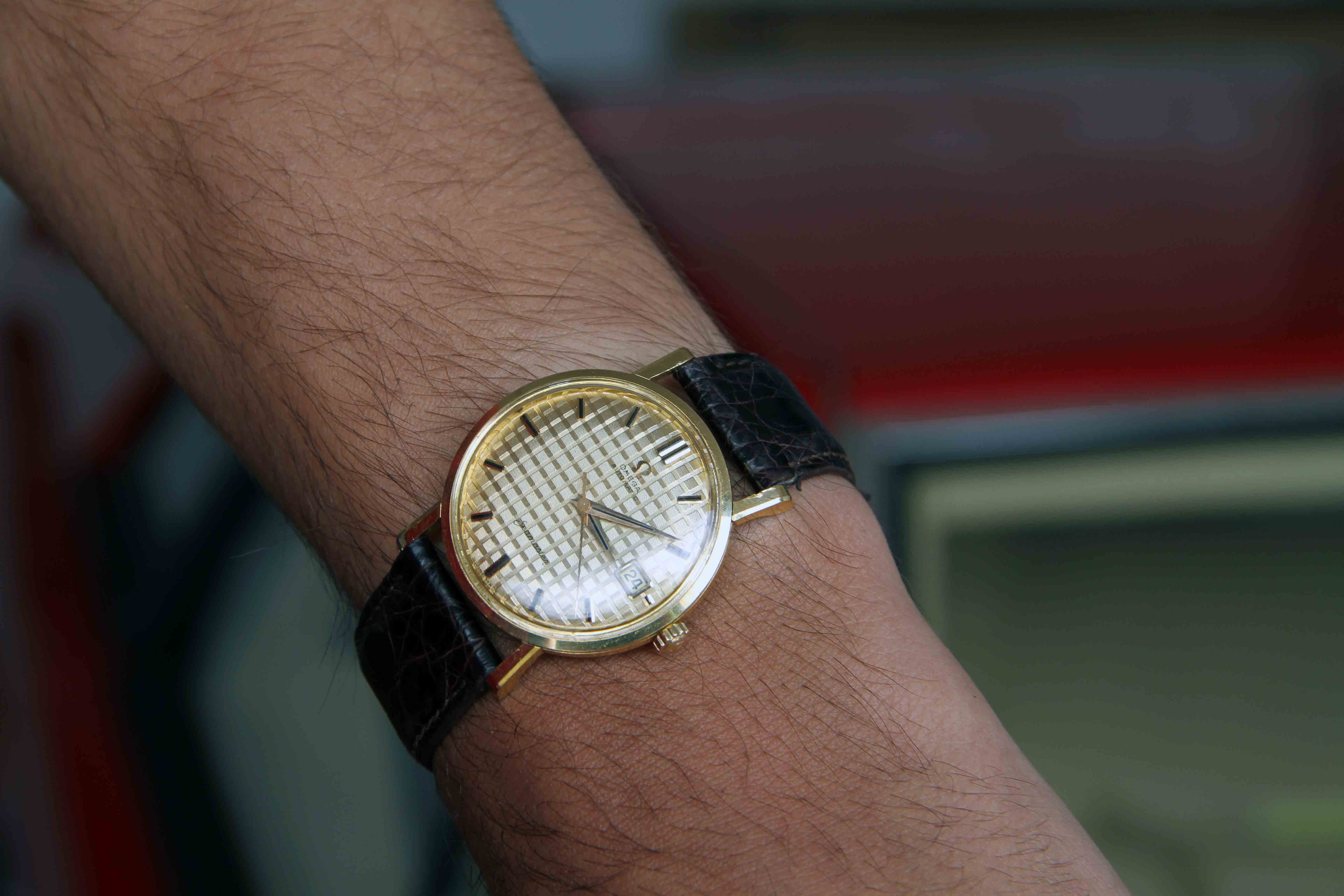 Omega Seamaster with waffle dial in 18K yellow gold.