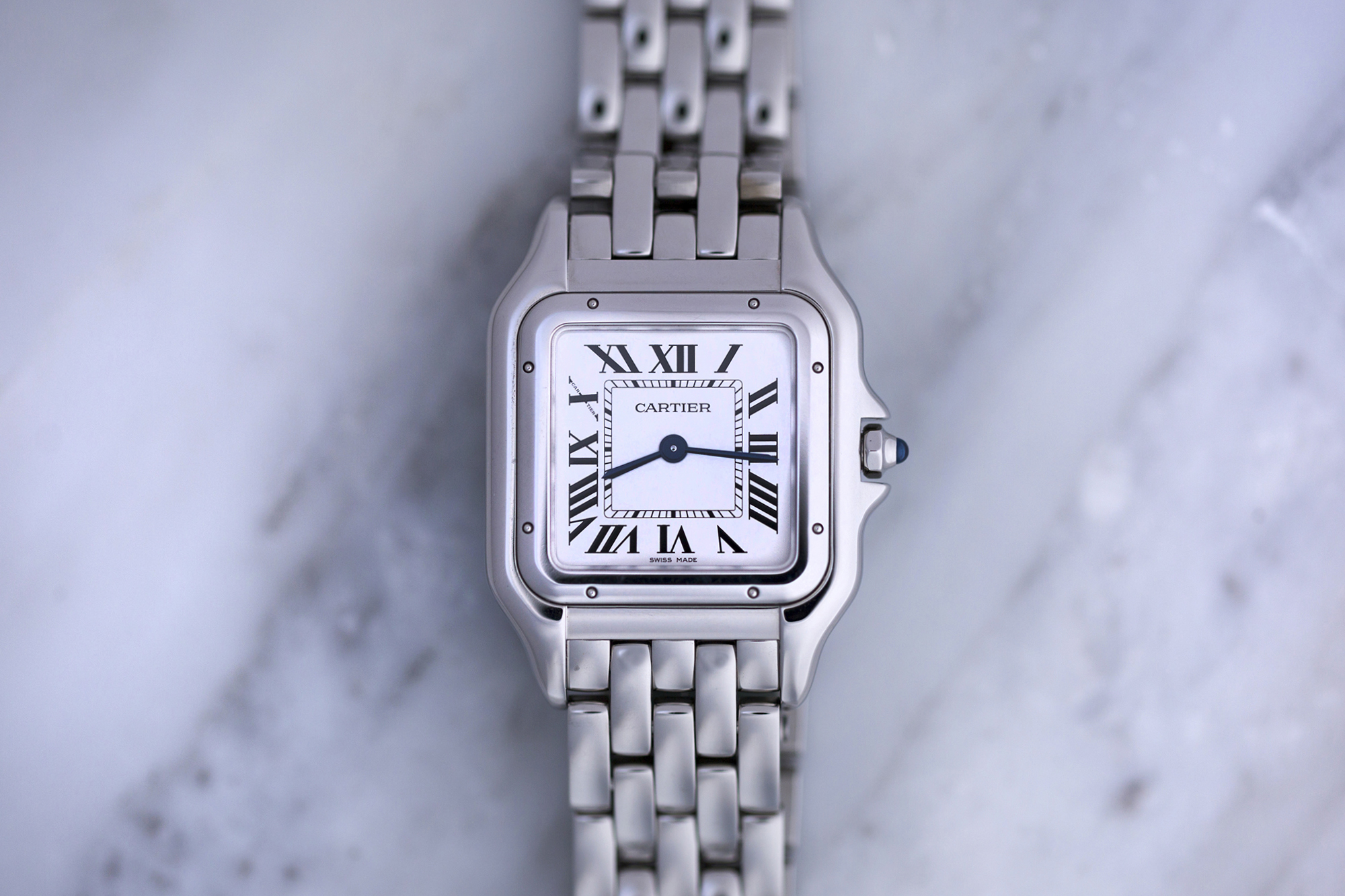 unclasping a cartier watch