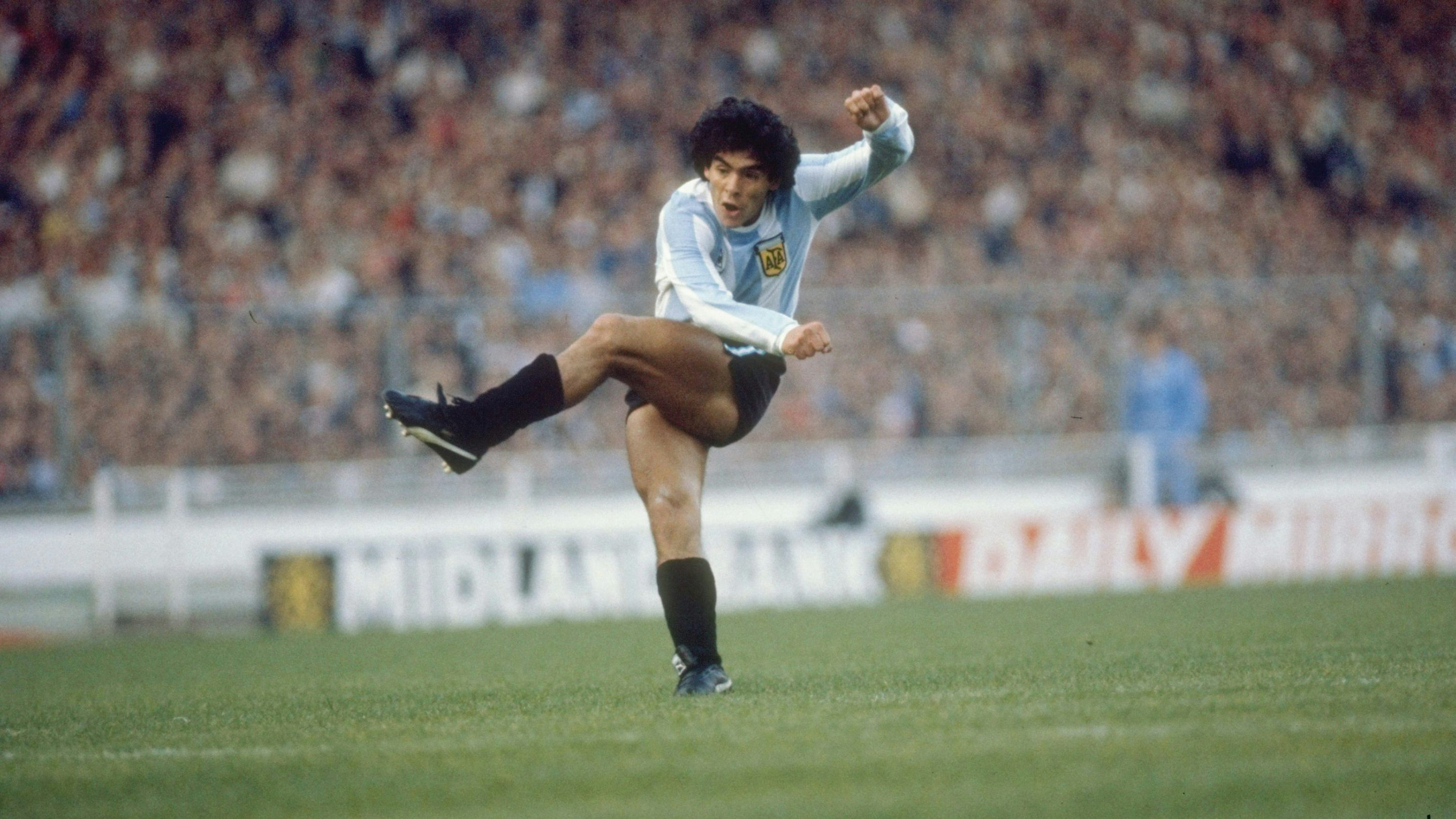 Former Argentina's soccer star Diego Maradona, left, shields the