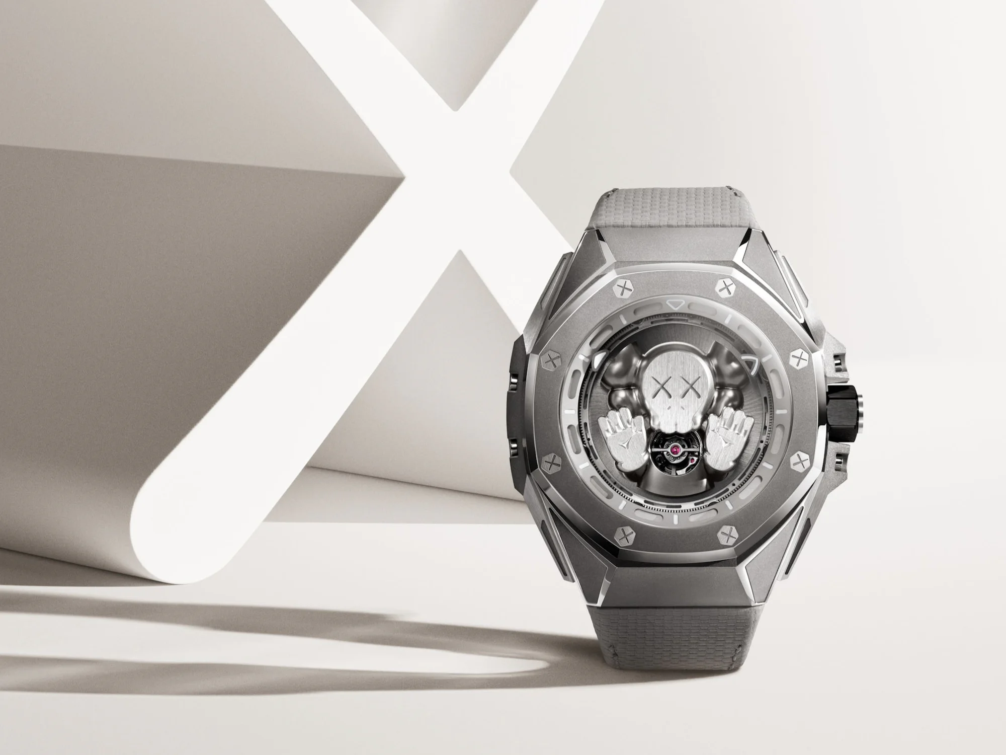 Kaws Tourbillon in front of an X sculpture