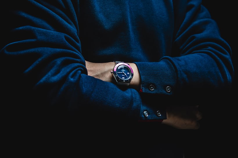 A man wears a Timex M79 'Fuchsia' Limited Edition