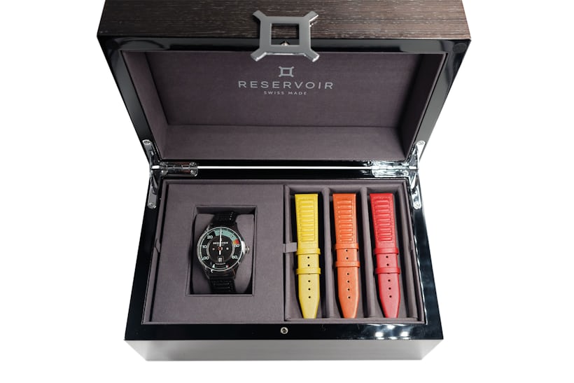 Kanister watch in a black case with three straps 