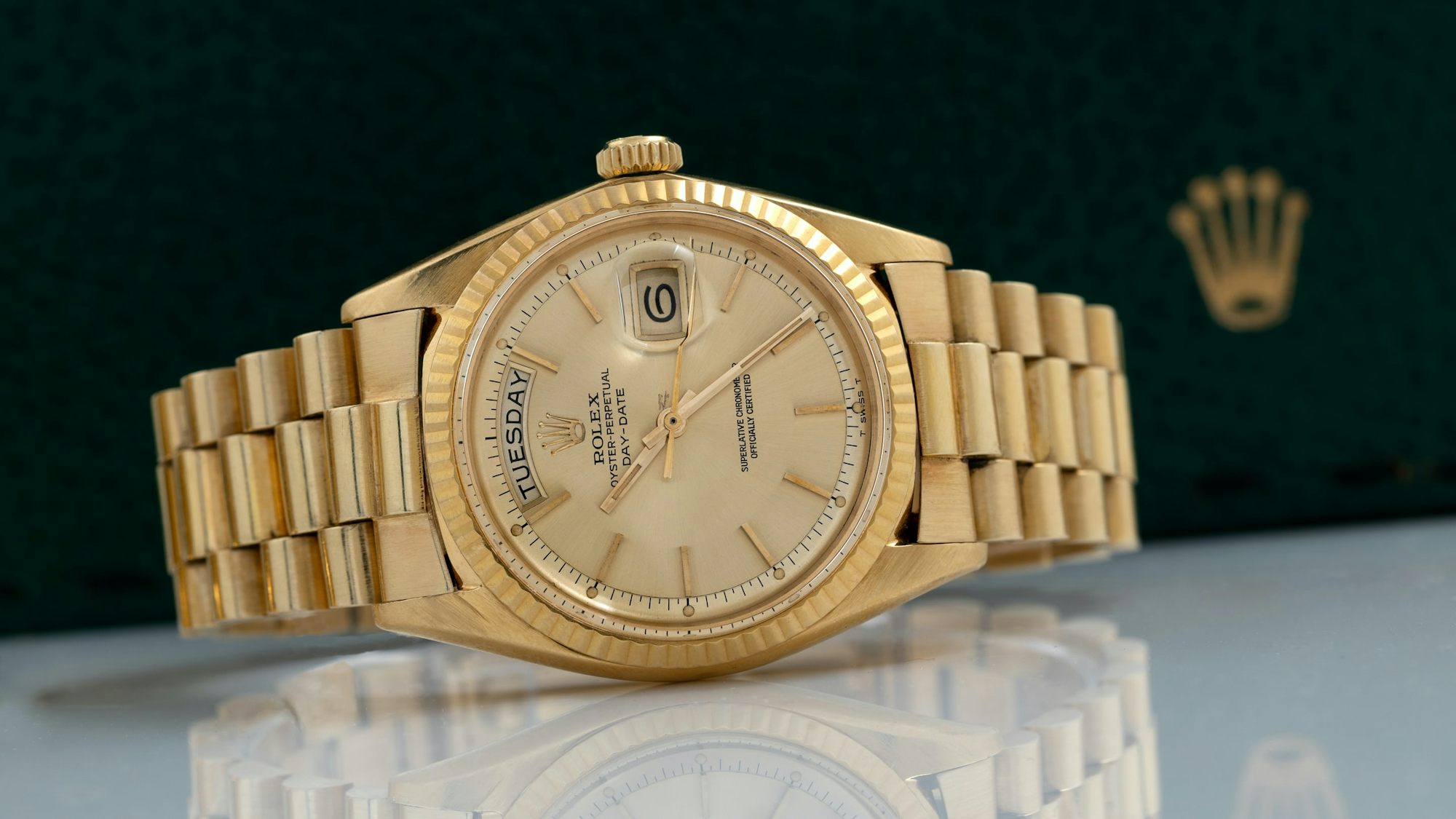 A yellow-gold Rolex Day-Date.