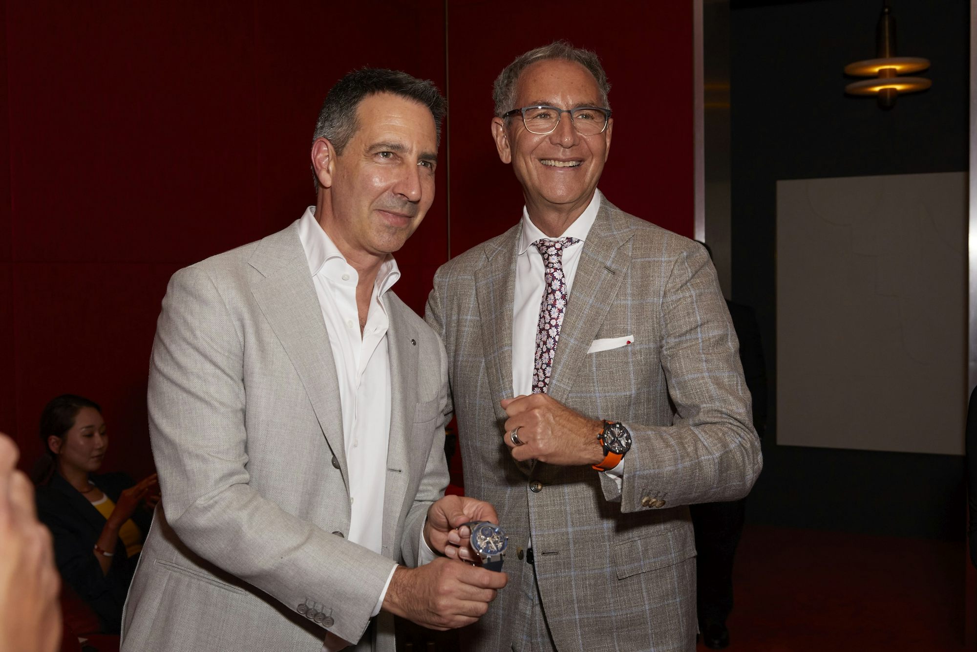Two men pose with their watches