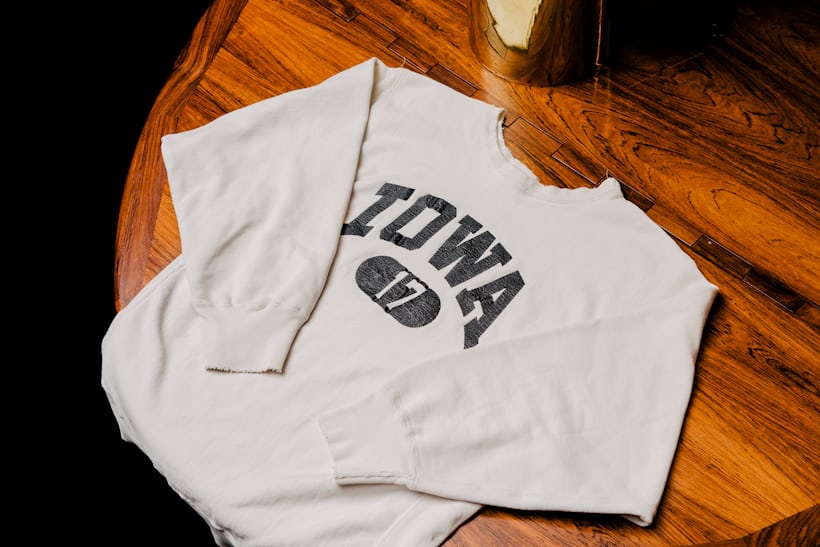 A white sweatshirt with the word "Iowa" written on it