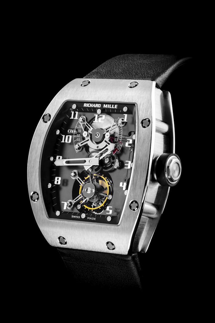 The RM100 Watch on a black background 