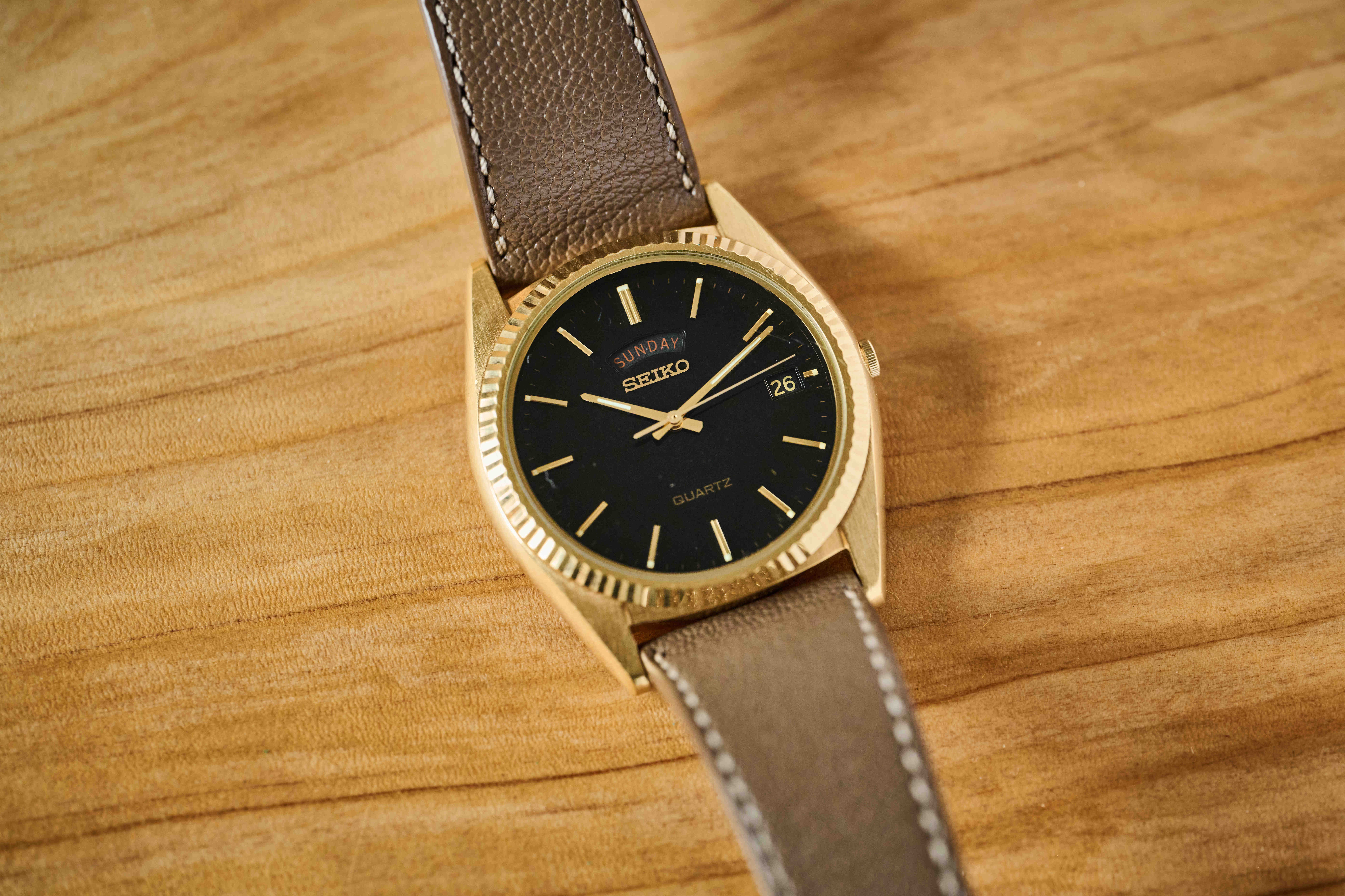 a gold tone seiko dress watch