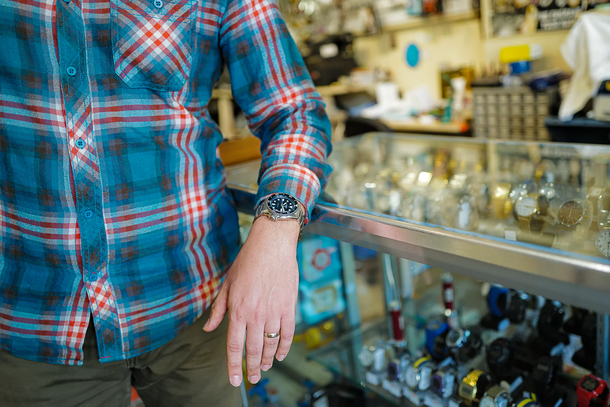 Inside the watch repair shop with the Seiko 5 Sports SRPD87 on wrist