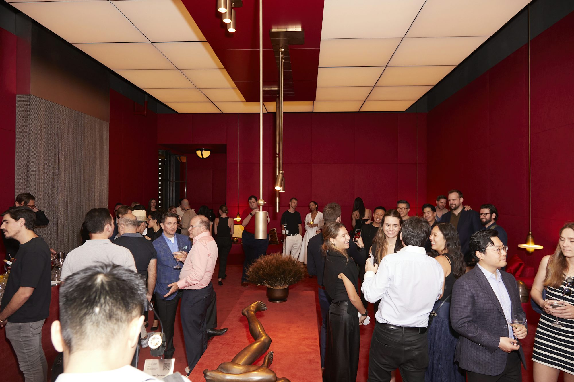 a red room full of people attending an event
