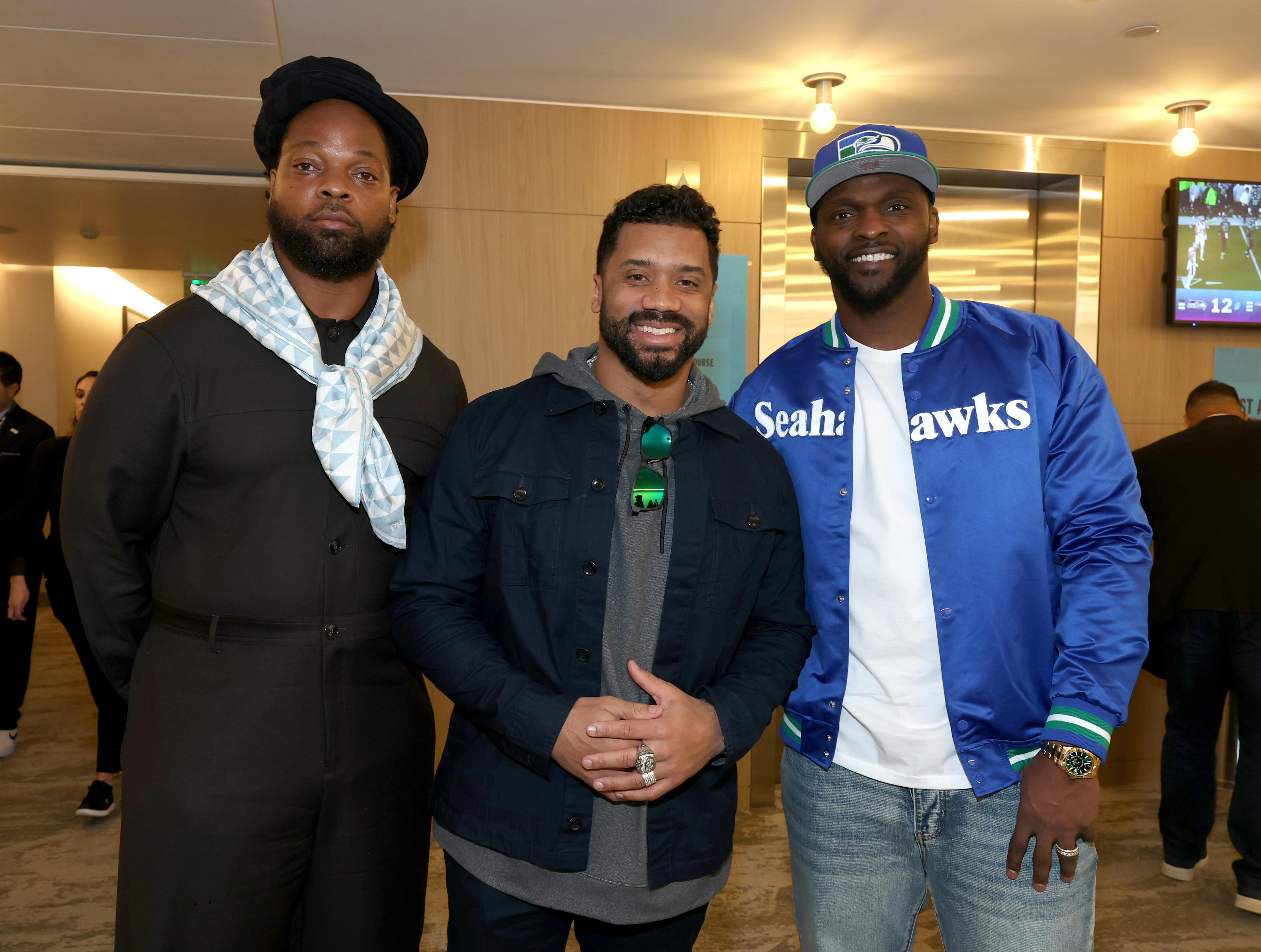 Michael Bennett, Russell Wilson and Cliff Avril 