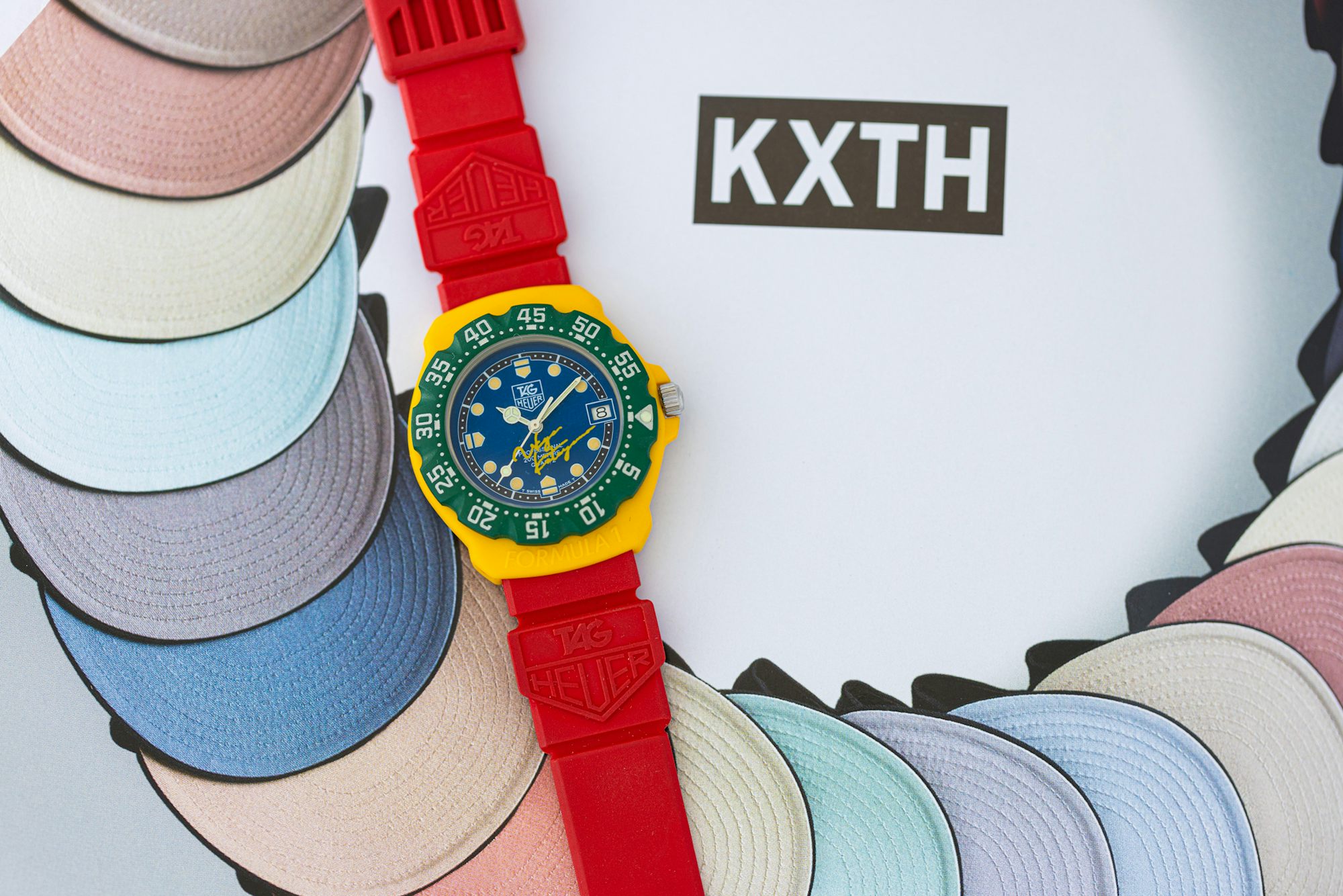 TAG Formula One watch featuring the signature of Ukyo Katayama on a background with the text "KXTH"
