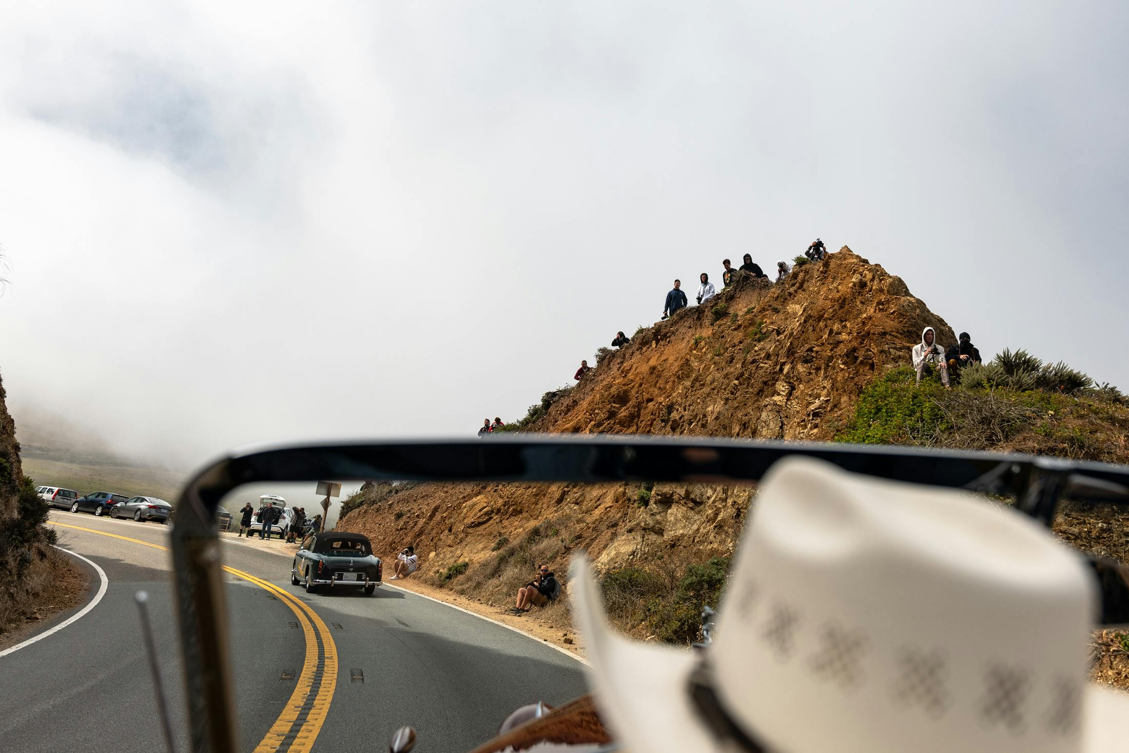 crowds line the hills. 