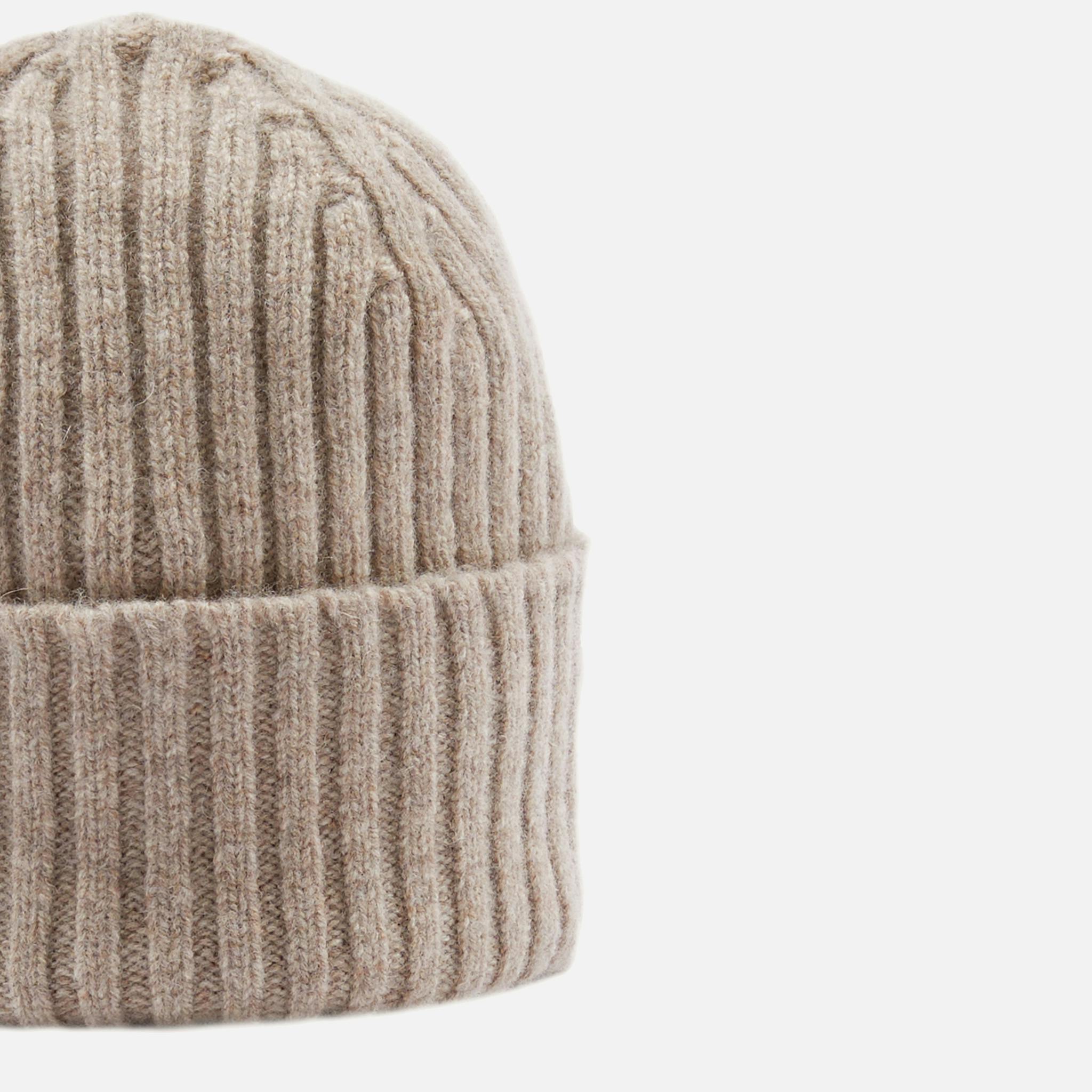 <p><a href="http://shop.hodinkee.com/products/drakes-lambswool-knit-cap" target="">Lambswool Knit Cap in Taupe</a></p>
