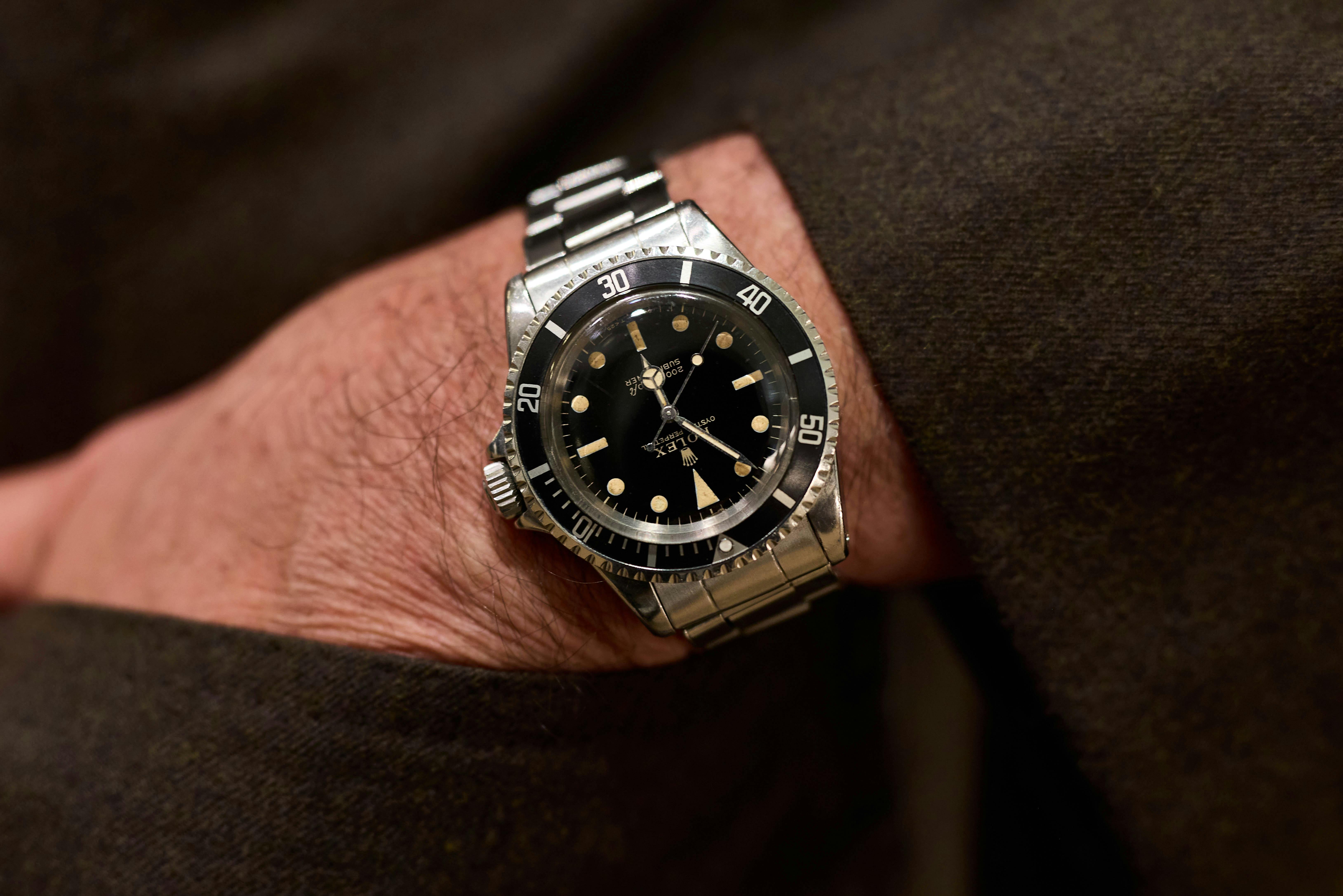 wearing a Rolex Submariner Ref. 5513 with gilt dial