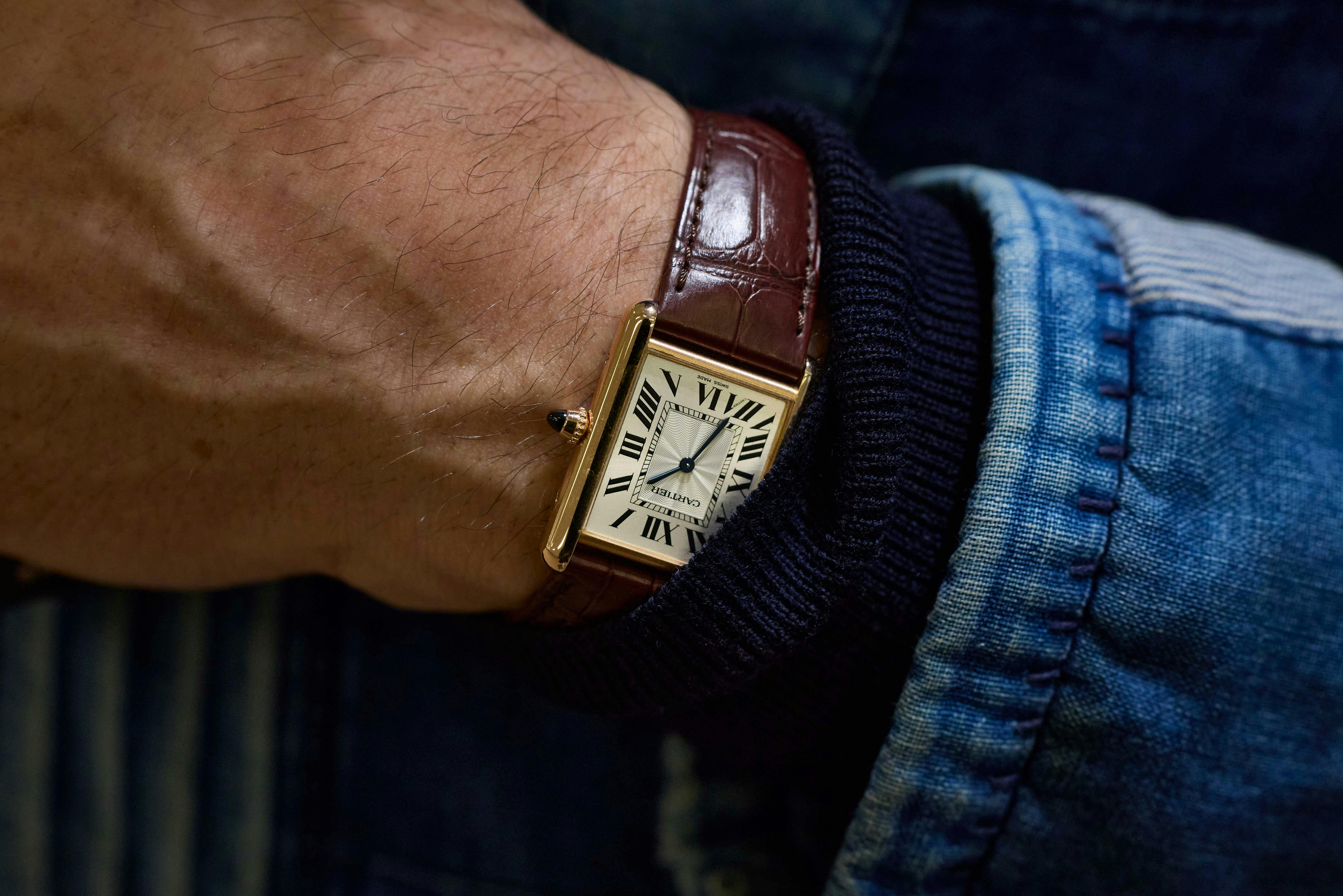 and a Cartier Tank Louis in 18k yellow gold