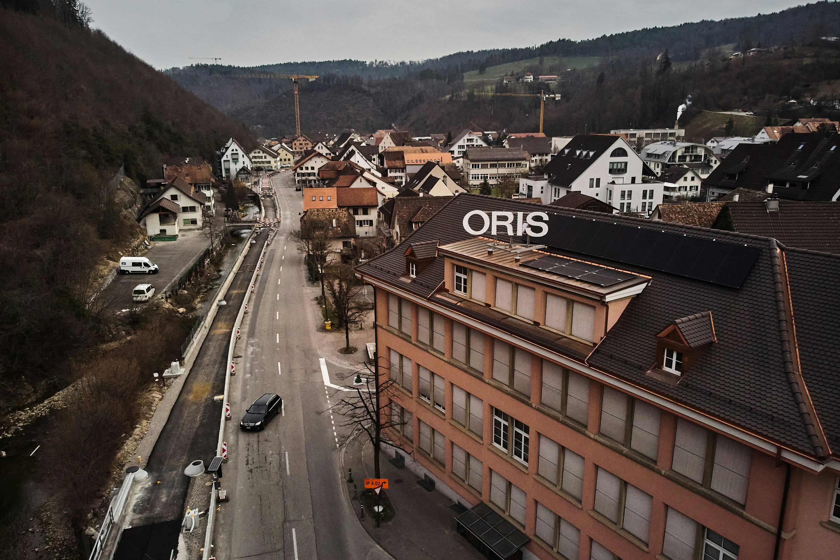A view of a town with an Oris sign on top of a building