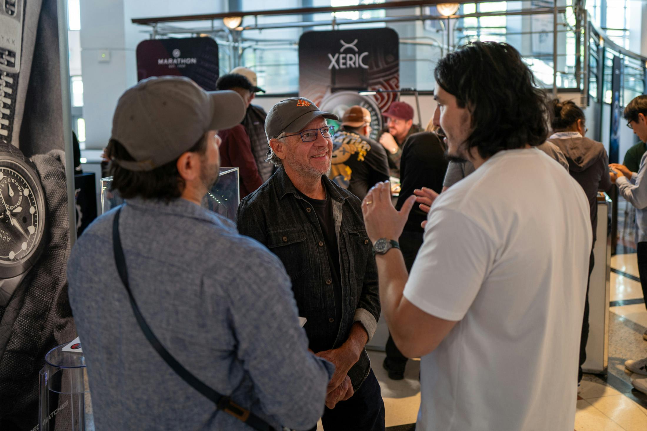 A discussion around the Arken booth