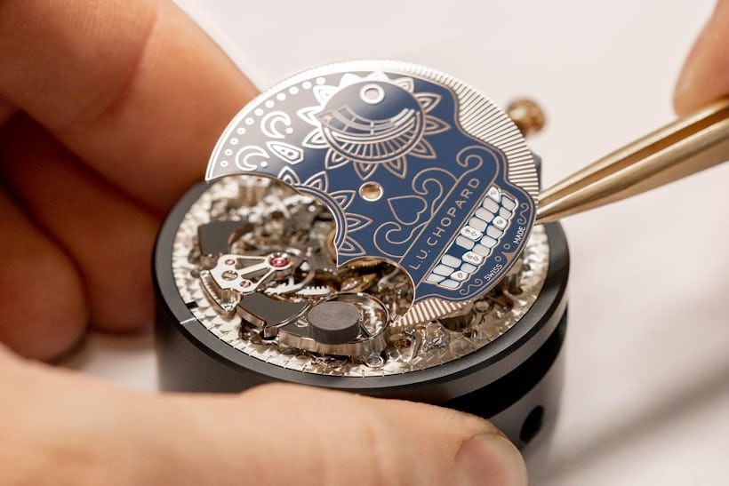 Placing the calavera skull dial on the movement