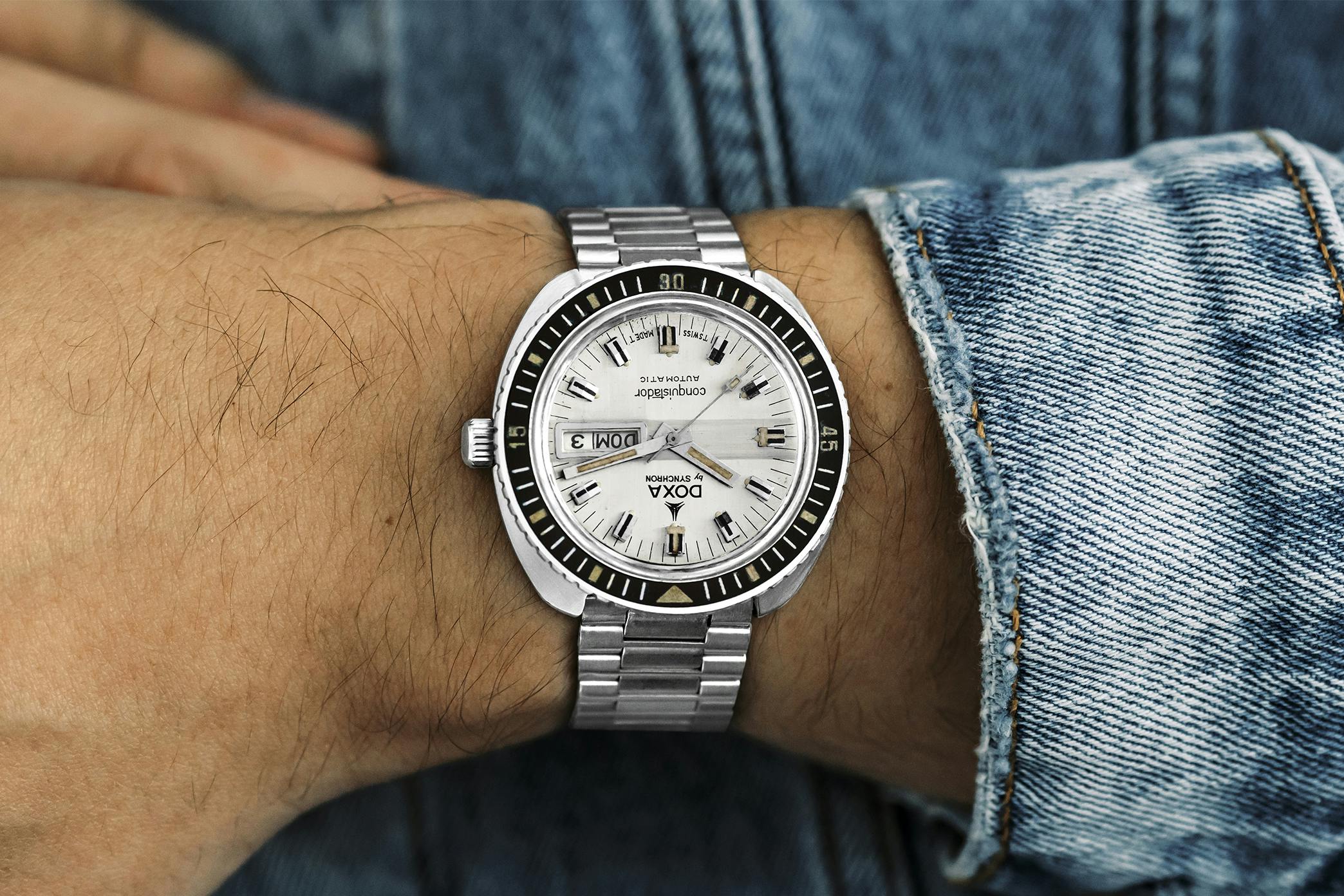 <p><a href="https://shop.hodinkee.com/products/conquistador-prototype-diver-on-bracelet-case-555-001-56-619-62?utm_source=hodinkee&amp;utm_medium=article&amp;utm_campaign=article-links-vintage" target="_blank"><u>1970s Doxa By Synchron Conquistador Ref. 619-61</u></a></p>