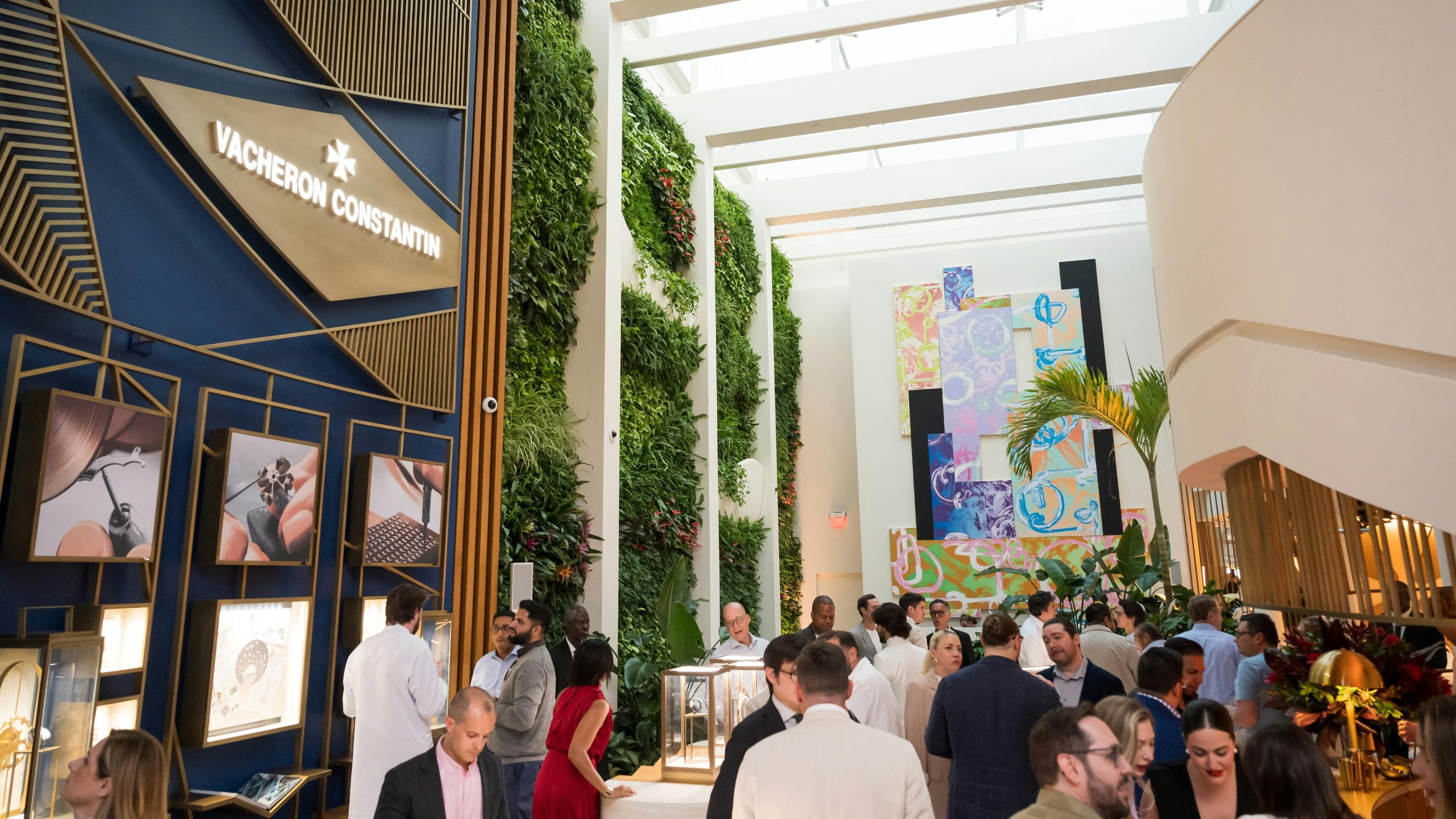 A crowd filling up the Miami Vacheron Boutique in the early evening light.