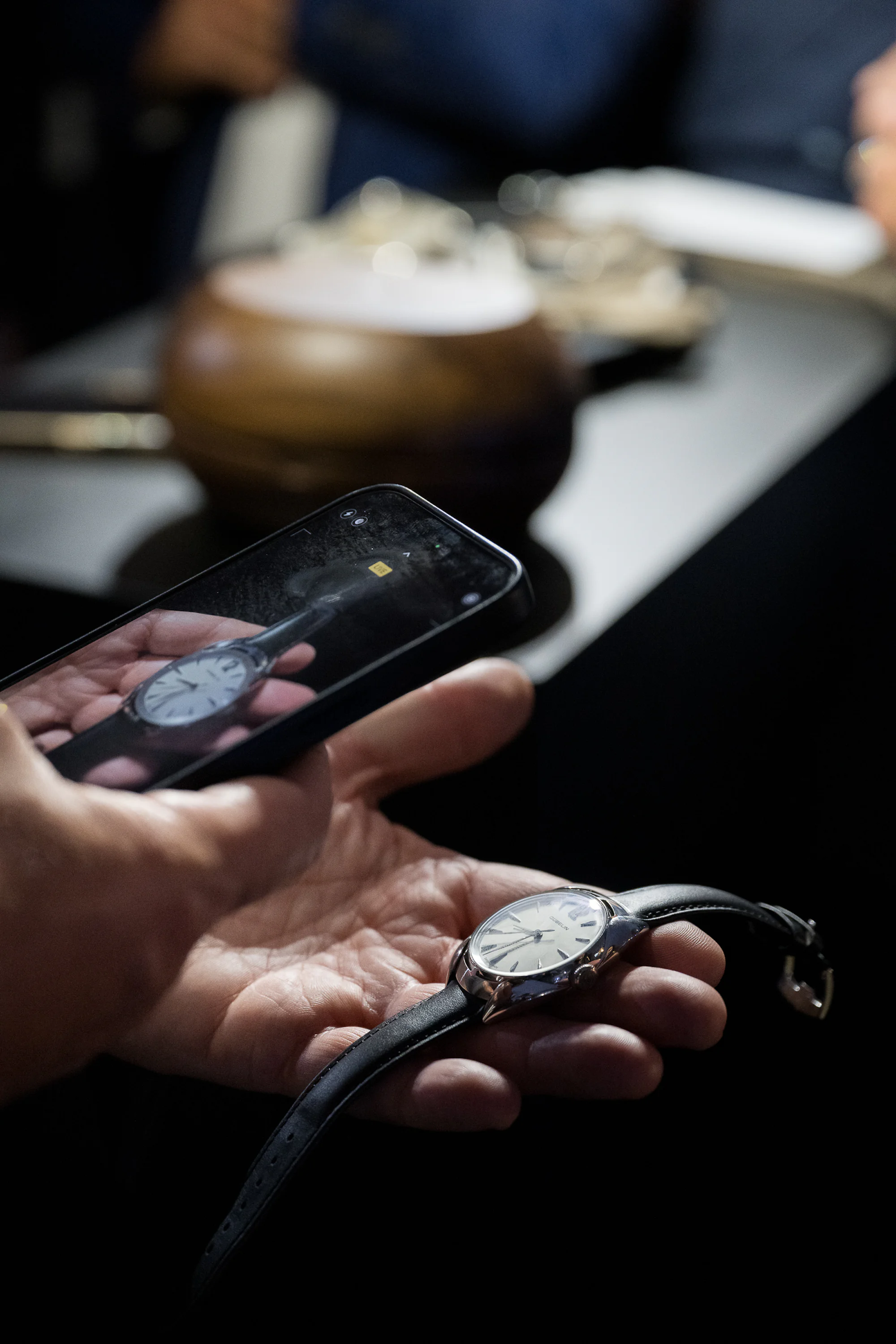 guest taking a photo of watch