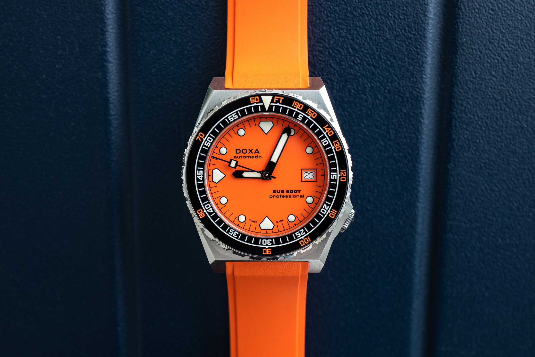 a portrait of the 600T professional on an orange rubber strap. 