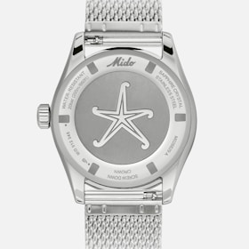 The caseback features the Ocean Star collection starfish logo.