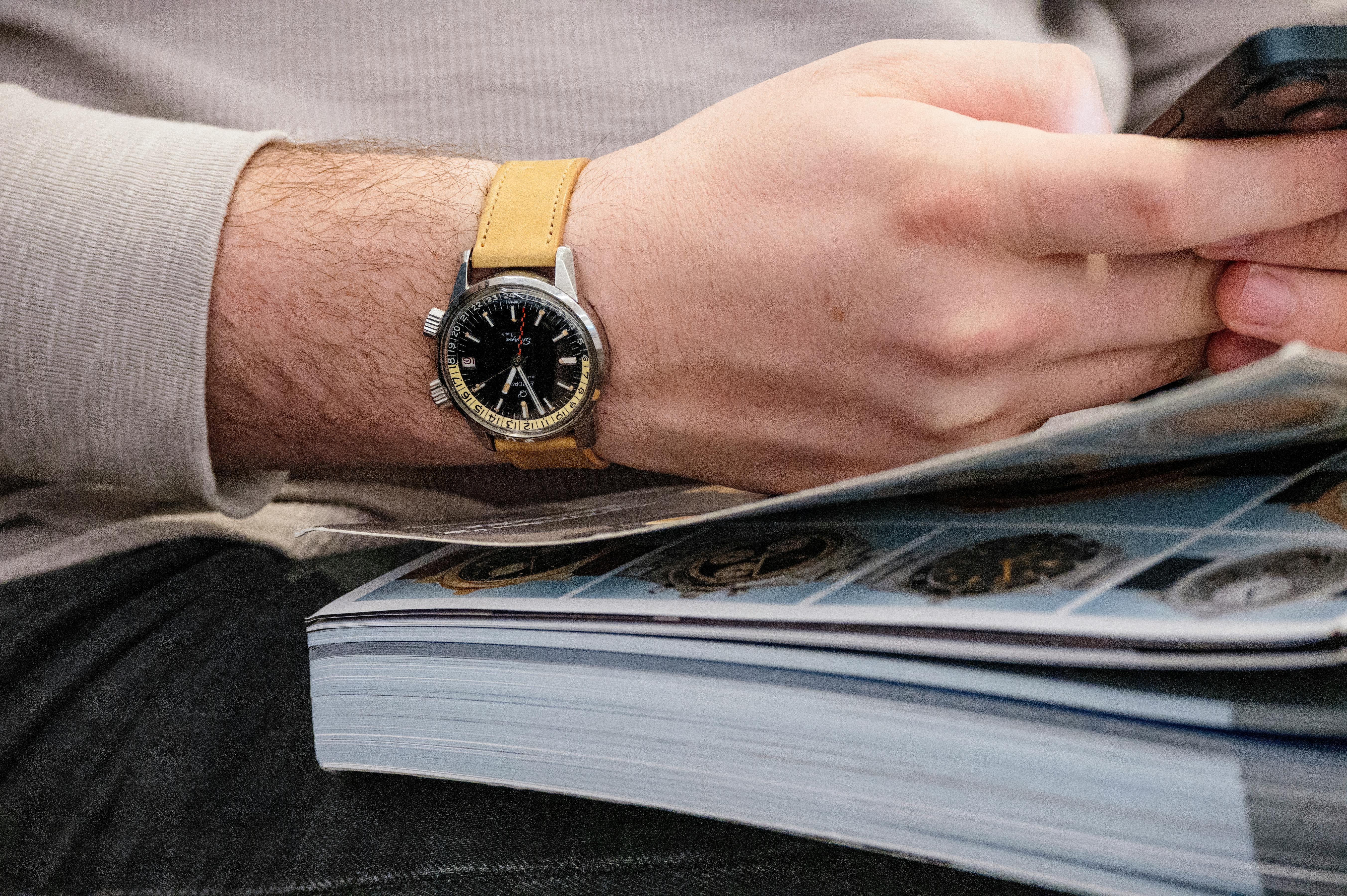 A man wears a 1960s Enicar Sherpa Jet GMT ref. 148-35-02