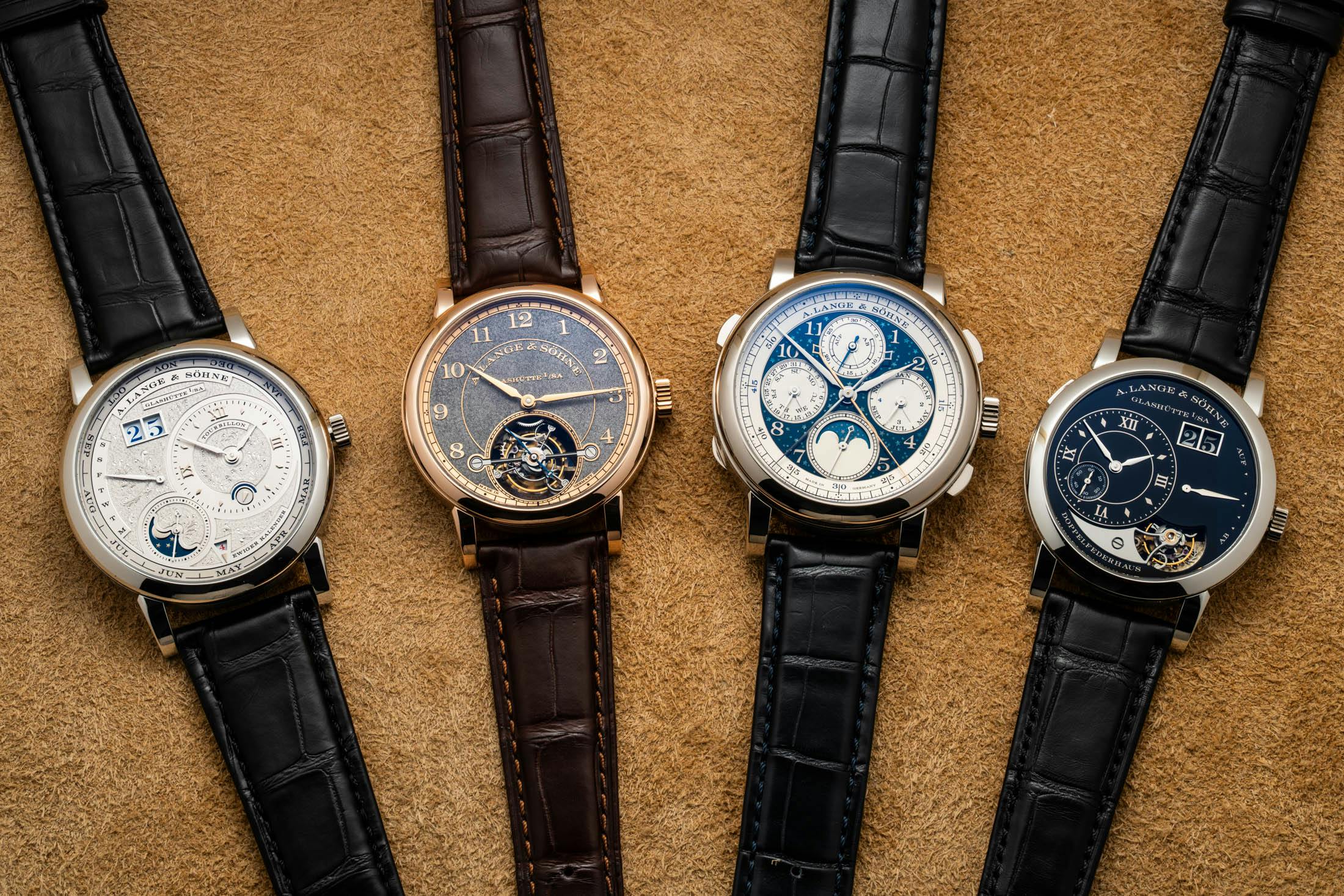 Four of Lange's Handwerkskunst models on leather background.